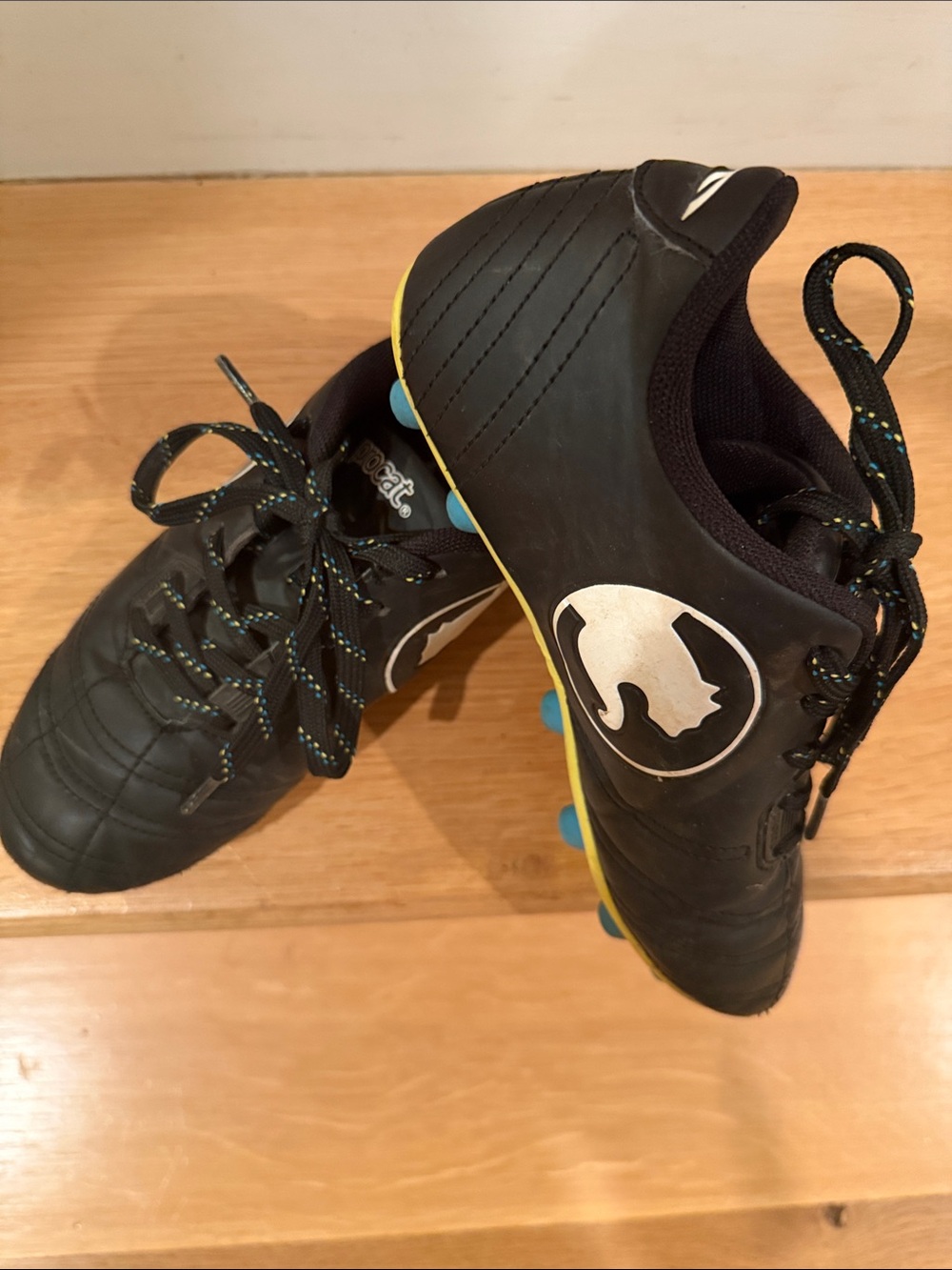 Procat Kids Black Soccer Sneakers with Yellow Trim and Blue Studs